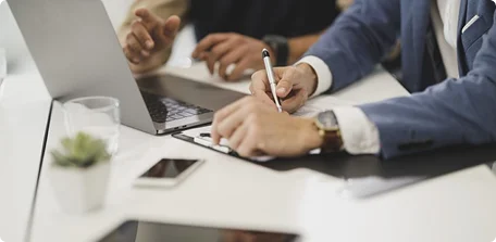 Contract being signed at a desk