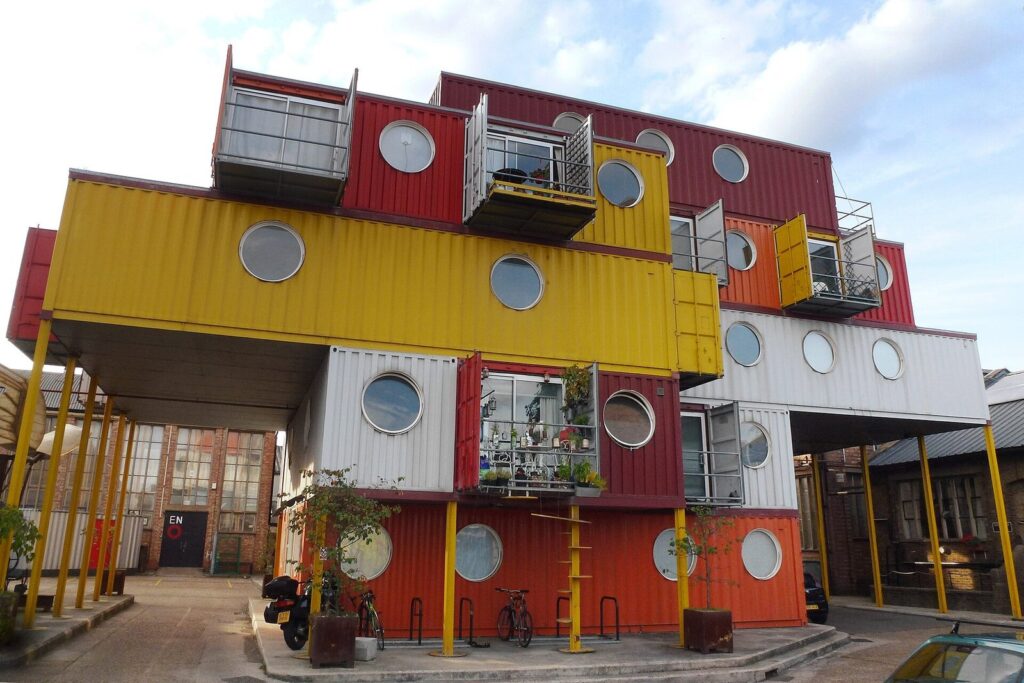 Brightly colored stacked steel shipping container modules forming an apartment and studio building at Container City in London